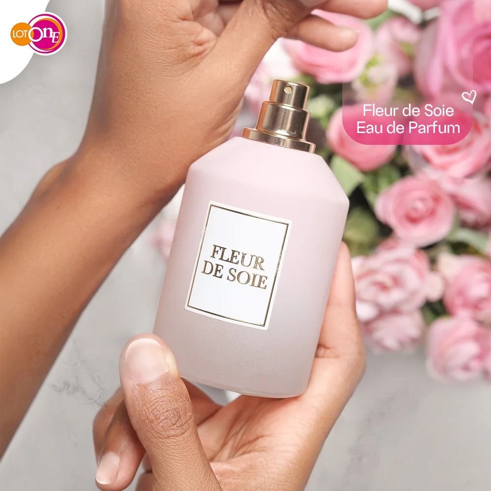 Stylish accessories and a perfume bottle neatly arranged on a vanity table