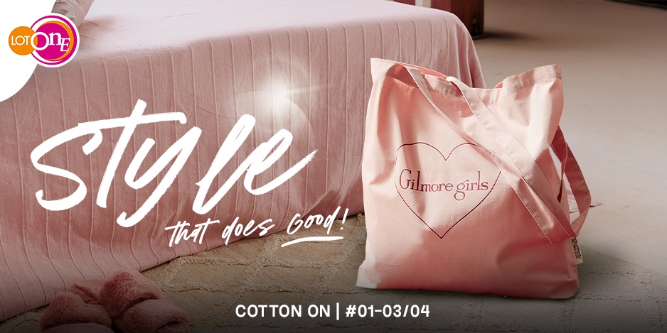 Person carrying a Cotton On sustainable tote bag