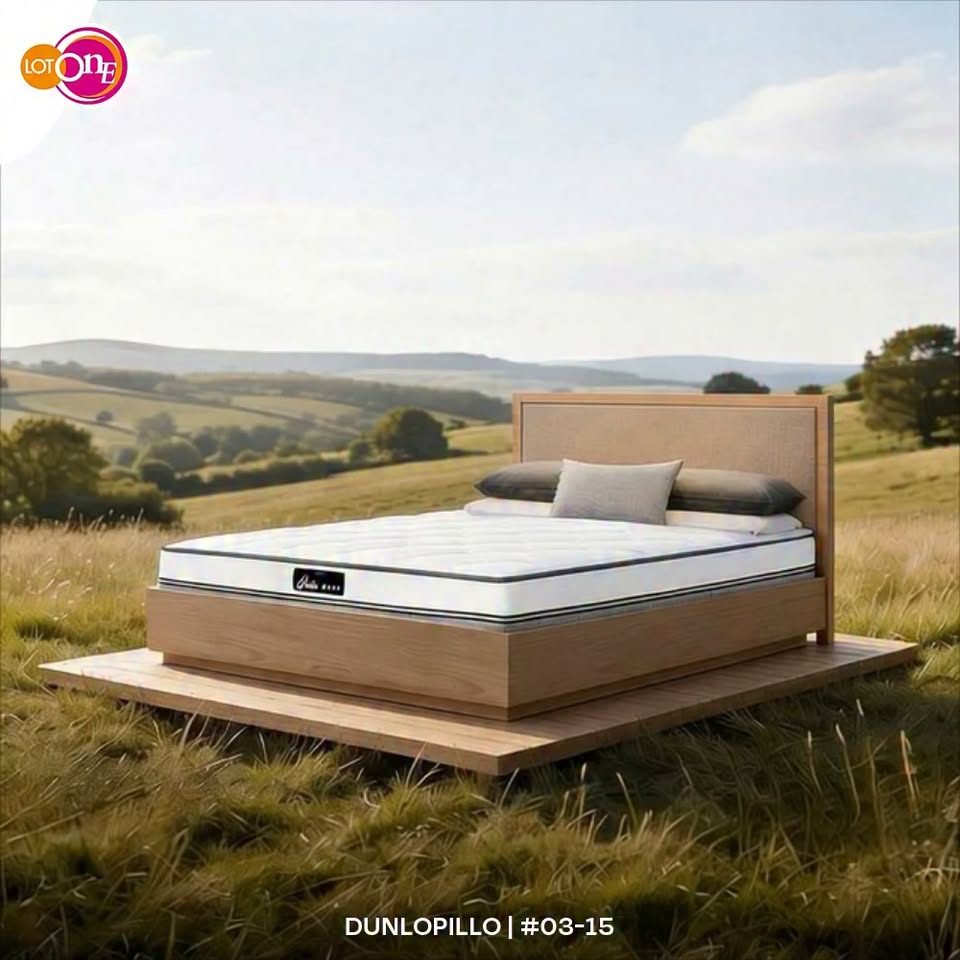Dunlopillo mattress displayed outdoors with white bedding as part of the Sleep in pure comfort campaign at Lot One