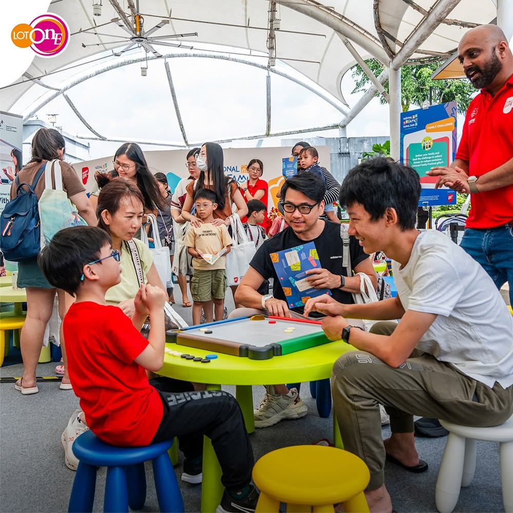 Families enjoying board games at the Families for Life event at Lot One