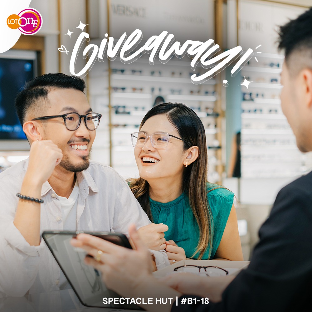 A pair of stylish eyeglasses on a surface, hinting at a fresh look and optical style.