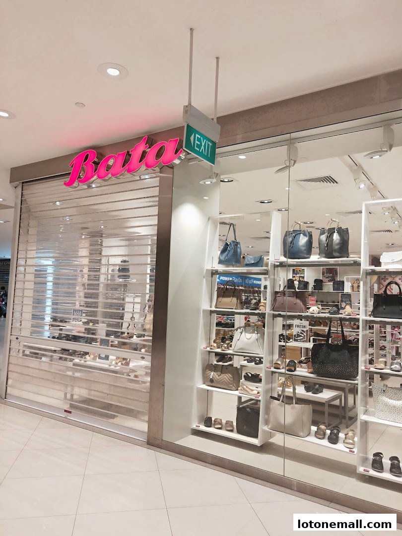 The Bata shoe store entrance with its logo and display shelves filled with shoes and bags.
