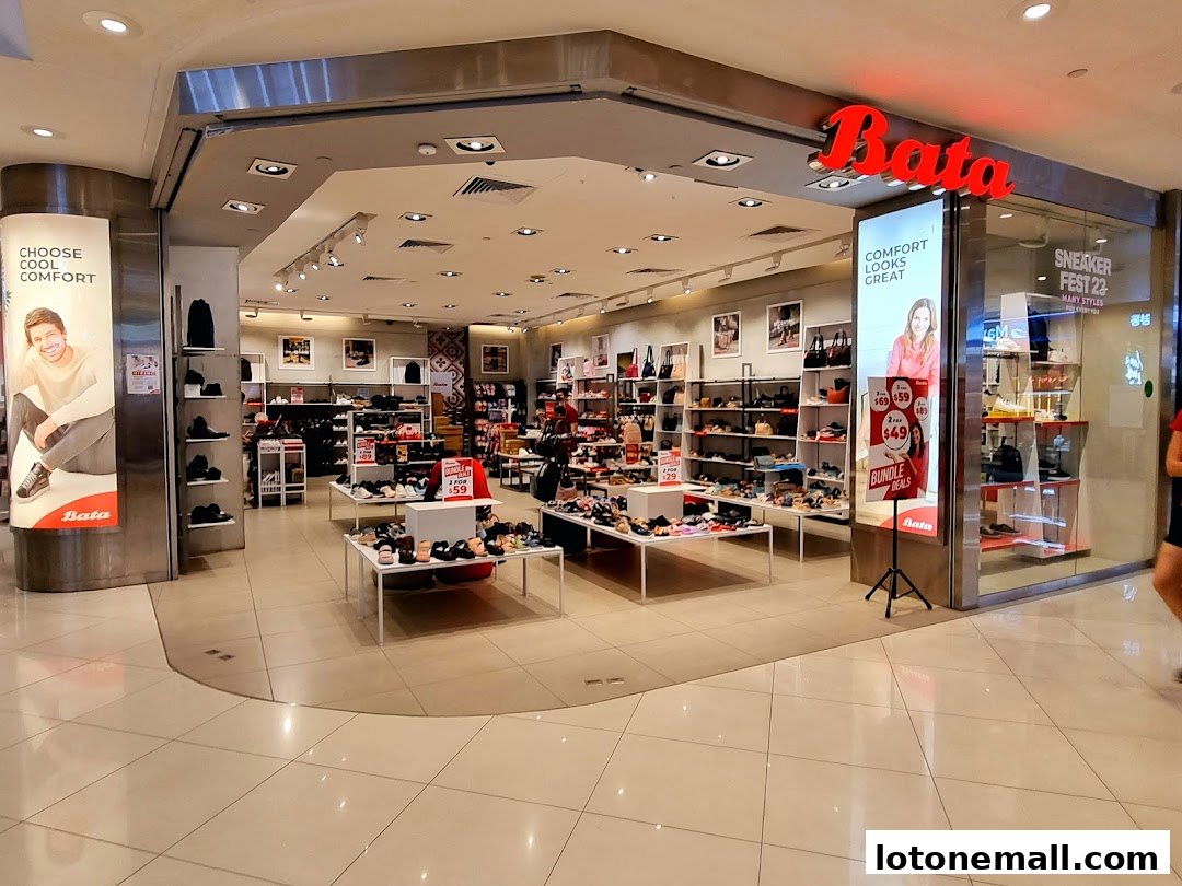 Interior view of a Bata shoe store showcasing various footwear and promotional displays.