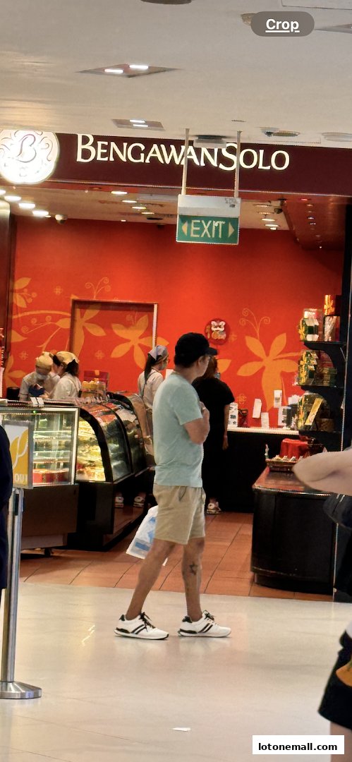 The Bengawan Solo shop front with a bright orange wall and display cases.