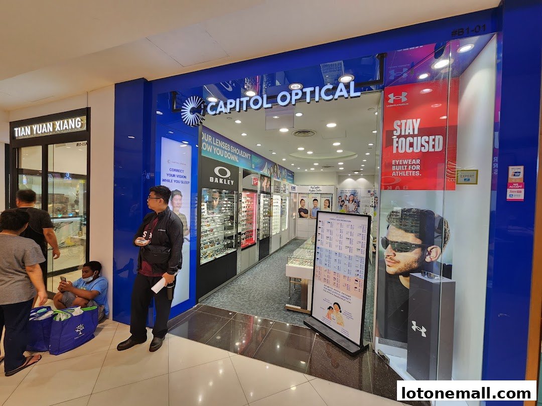 The exterior of Capitol Optical, showcasing eyewear and promotional materials.
