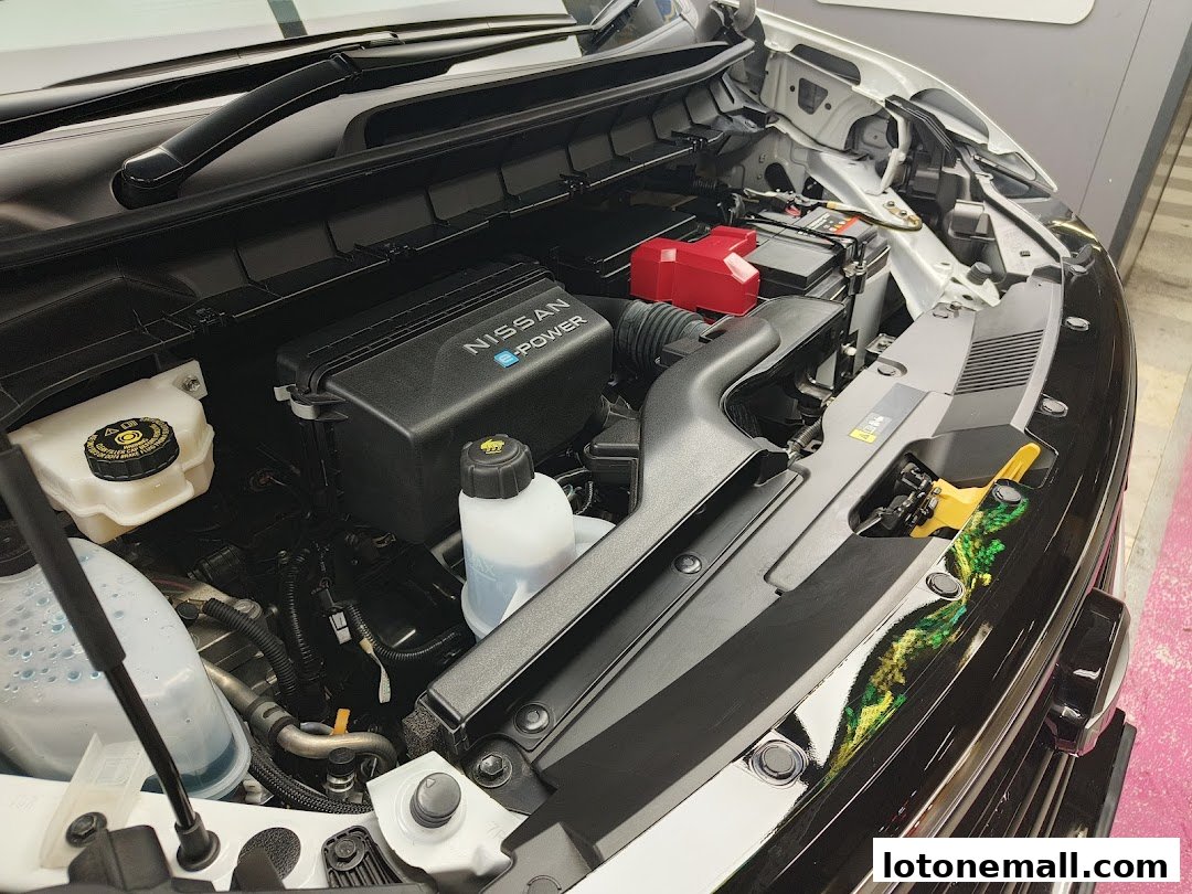 Close-up view of a clean and detailed car engine bay, featuring Nissan e-Power technology.