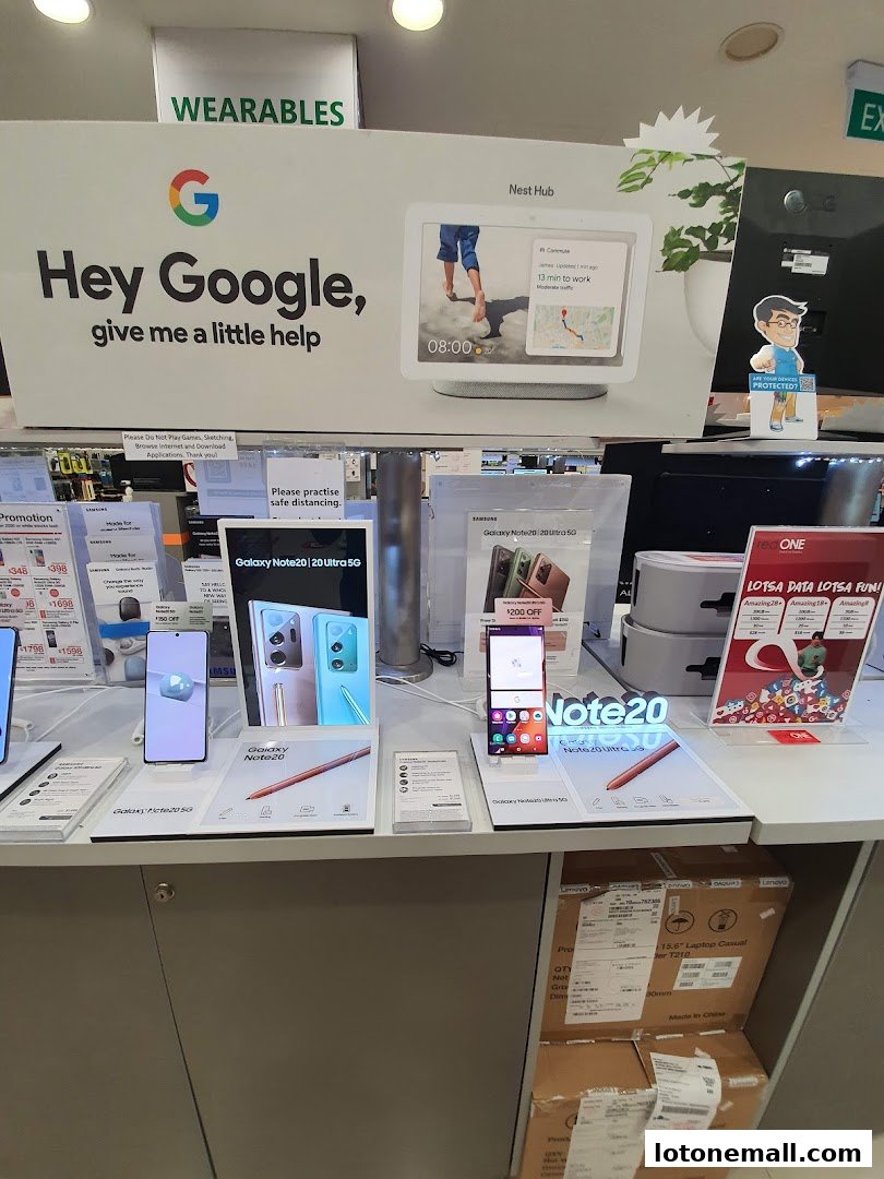 A display of Samsung Galaxy Note 20 phones and Google Nest Hub devices at a retail store.