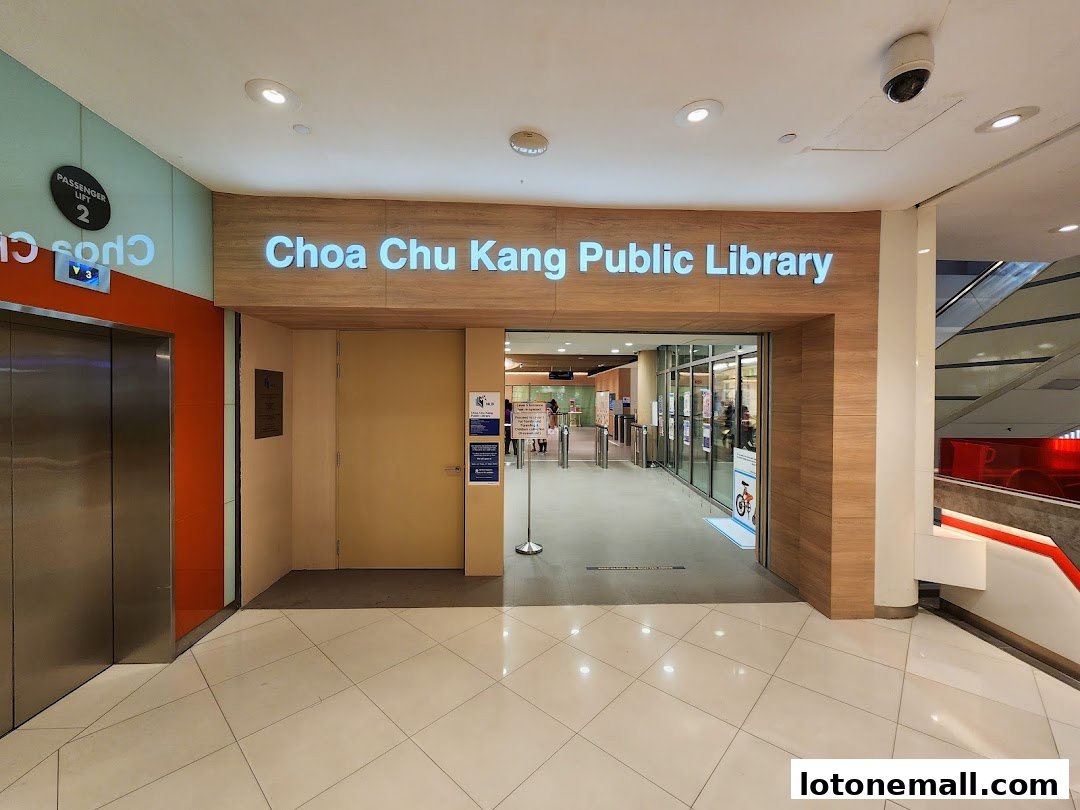 The entrance to Choa Chu Kang Public Library with signage and an elevator.