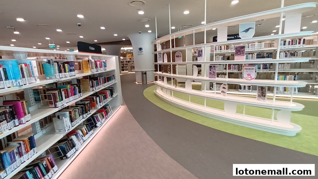 Interior view of a modern library with shelves full of books and seating areas.