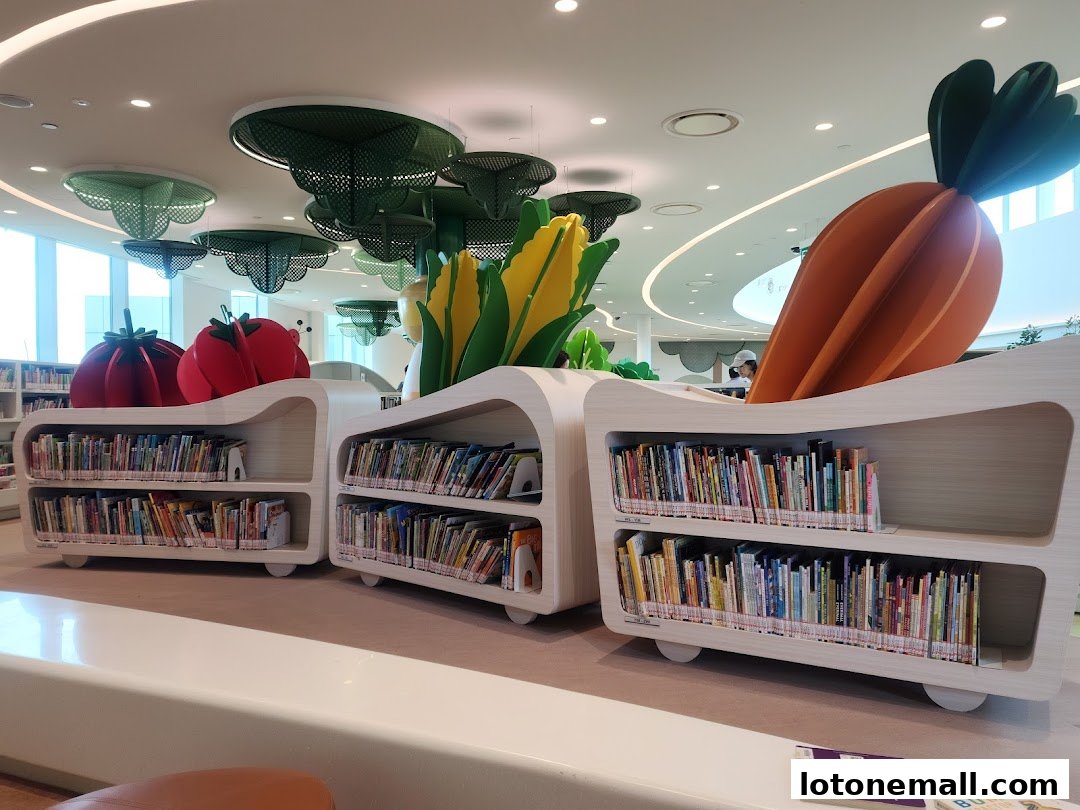 Interior of a library with colorful book shelves and playful vegetable-themed decor.