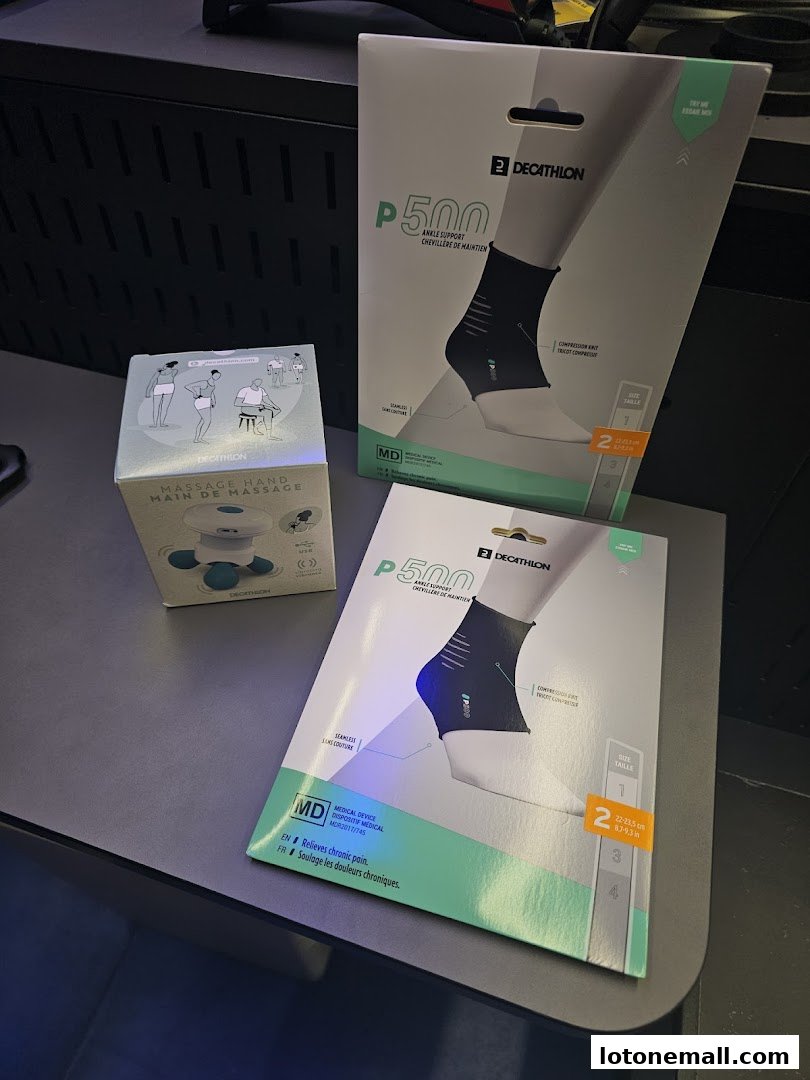 Two boxes of Decathlon P500 ankle supports and a Decathlon massage hand device.