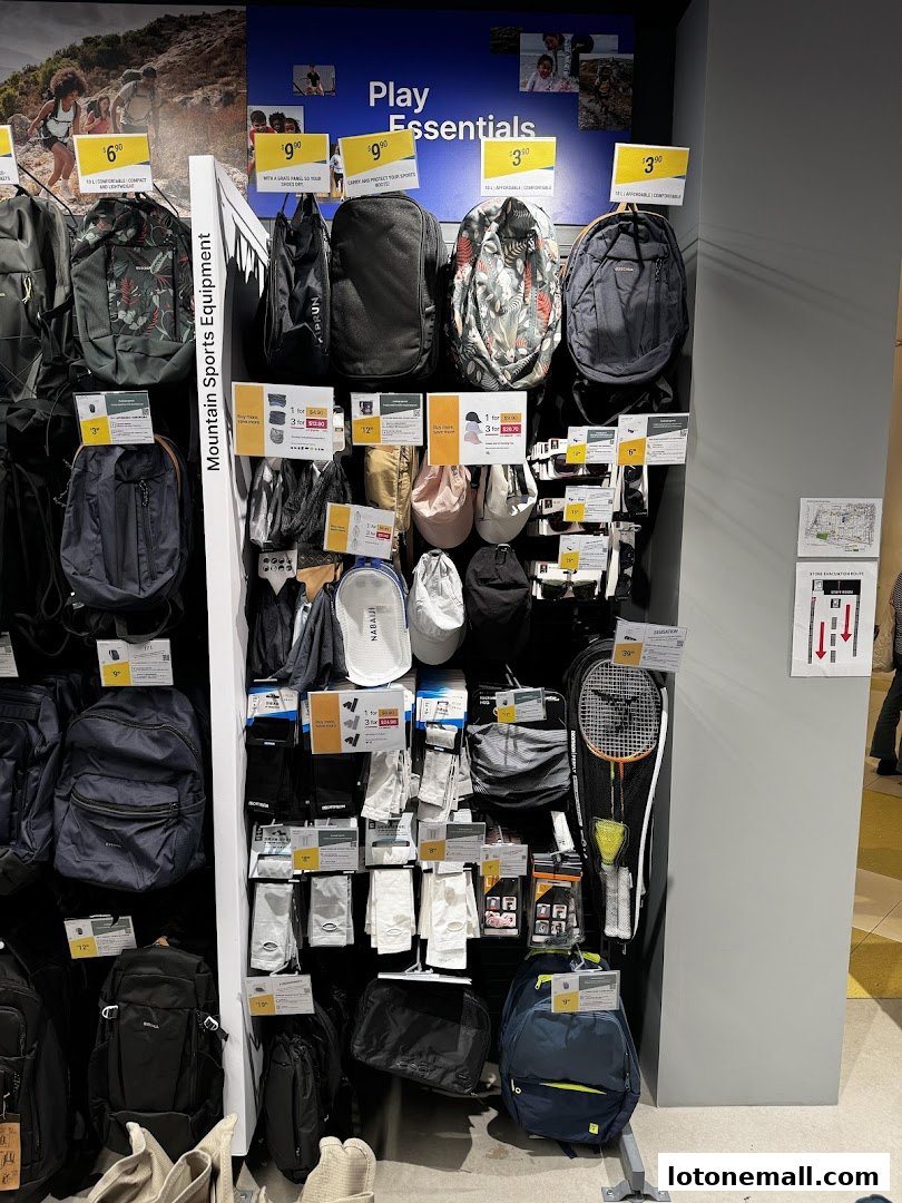 A display of backpacks, hats, and sports accessories at Decathlon.