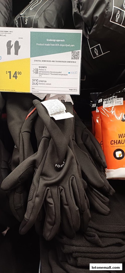 A display of black gloves with a price tag and product information.