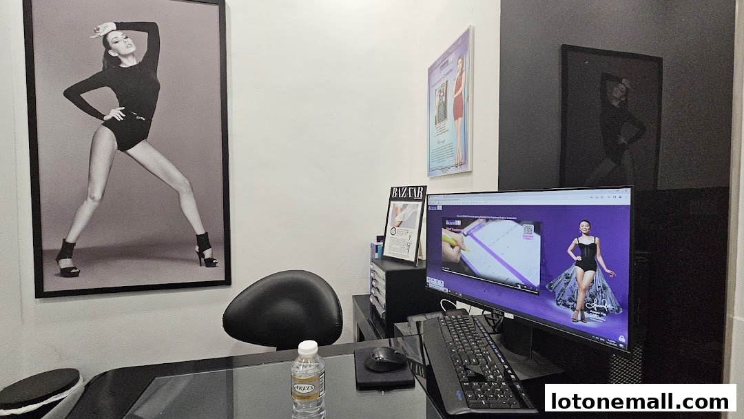 Interior shot of a slimming treatment center with posters and a computer.