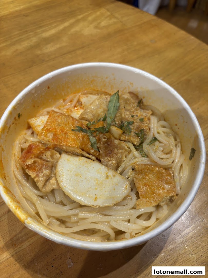A close-up shot of a delicious bowl of noodles with various toppings.