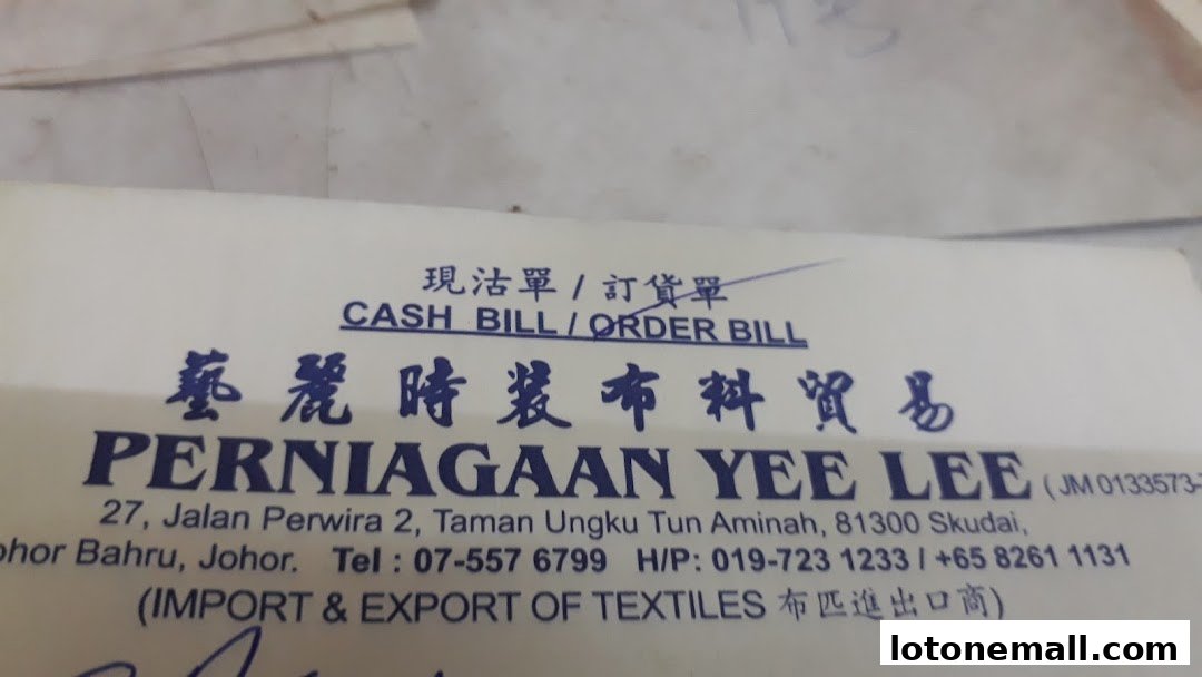 A close-up of a bill from Perniagaan Yee Lee, an import and export textile business.