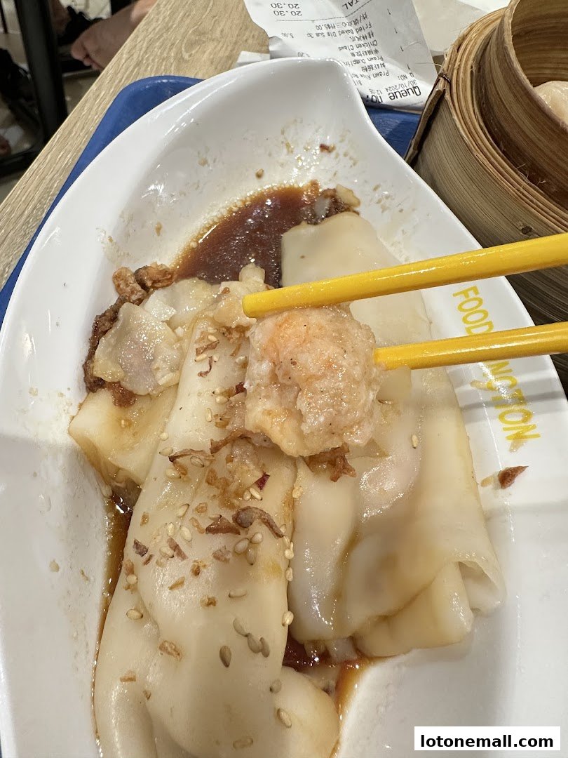 A close-up of delicious dim sum being picked up with chopsticks at Fortunate Dim Sum.