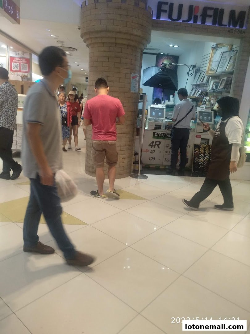 The Fujifilm Mach Photo shop front with customers and staff inside.