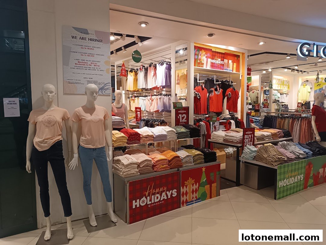 The Giordano store displays clothing on racks and shelves, with mannequins at the entrance.