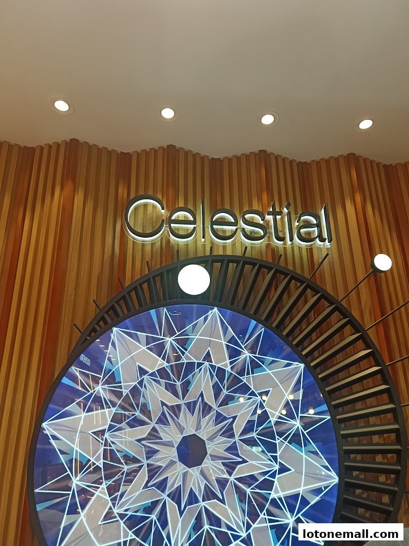 A shop interior with a neon sign that says 'Celestial' above a decorative circular display.