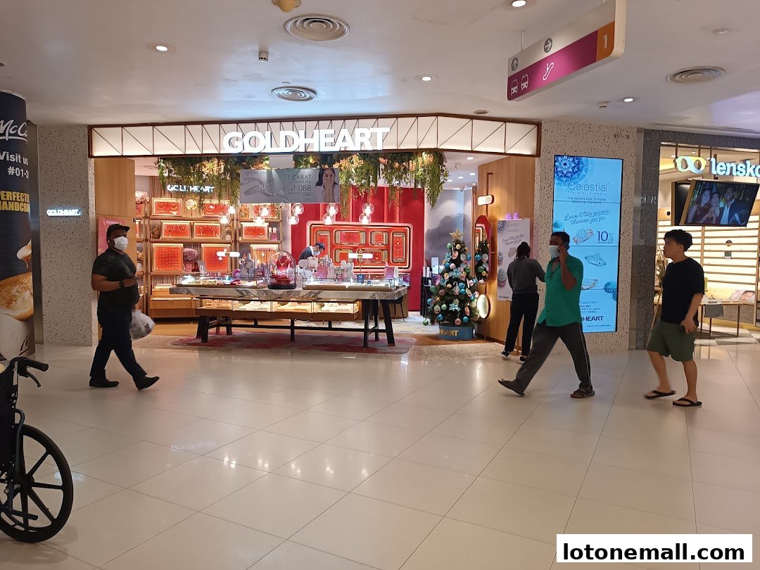 The Goldheart Jewelry store entrance with displays of jewelry and a Christmas tree.