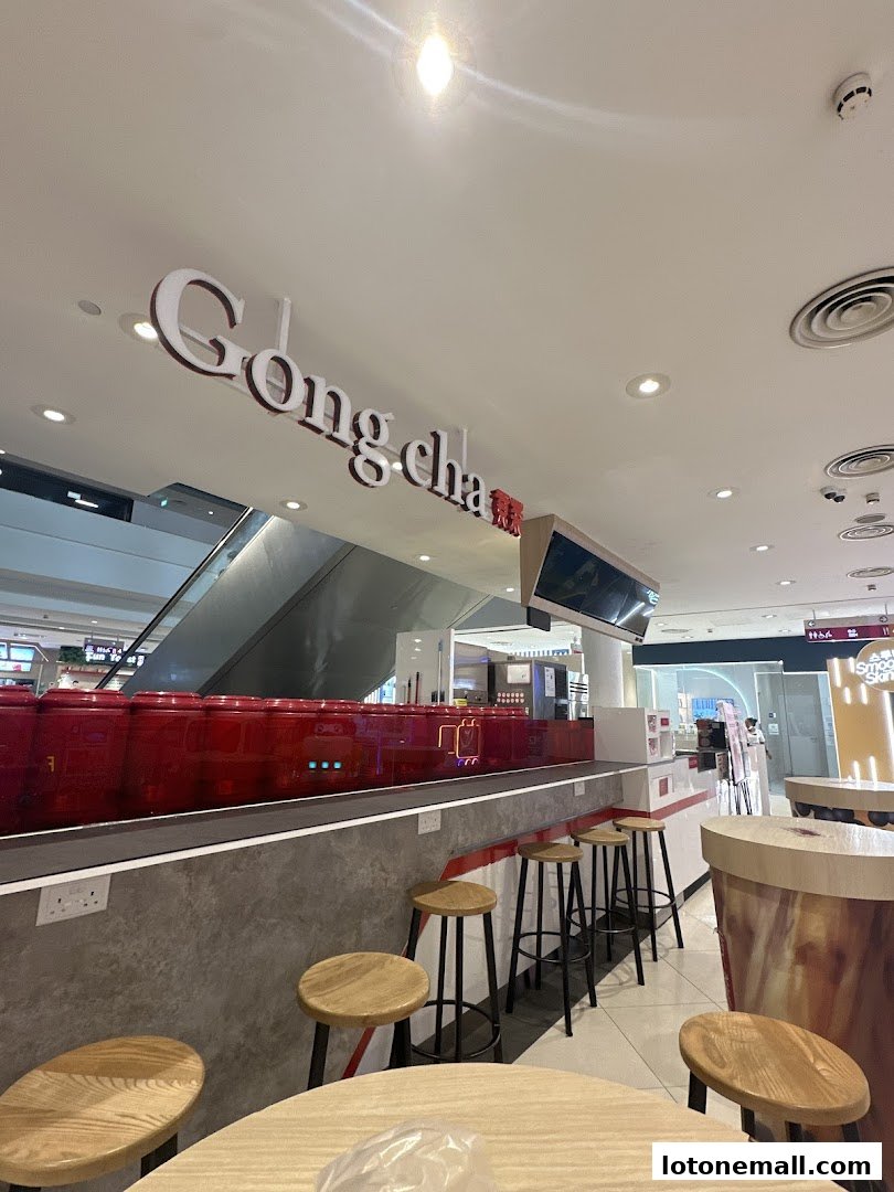 Interior view of a Gong Cha bubble tea shop with seating and counter.