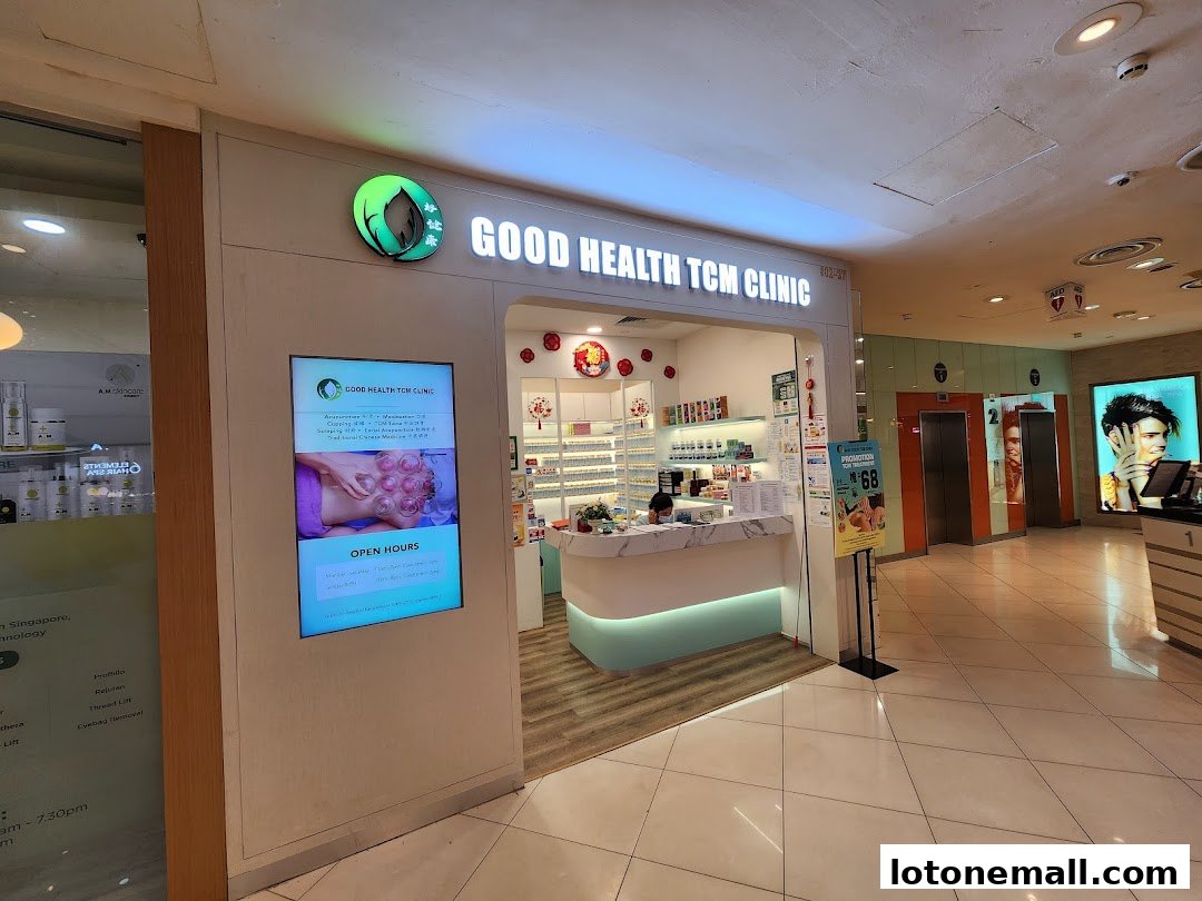 The exterior of Good Health TCM Clinic with a digital display showing services and open hours.
