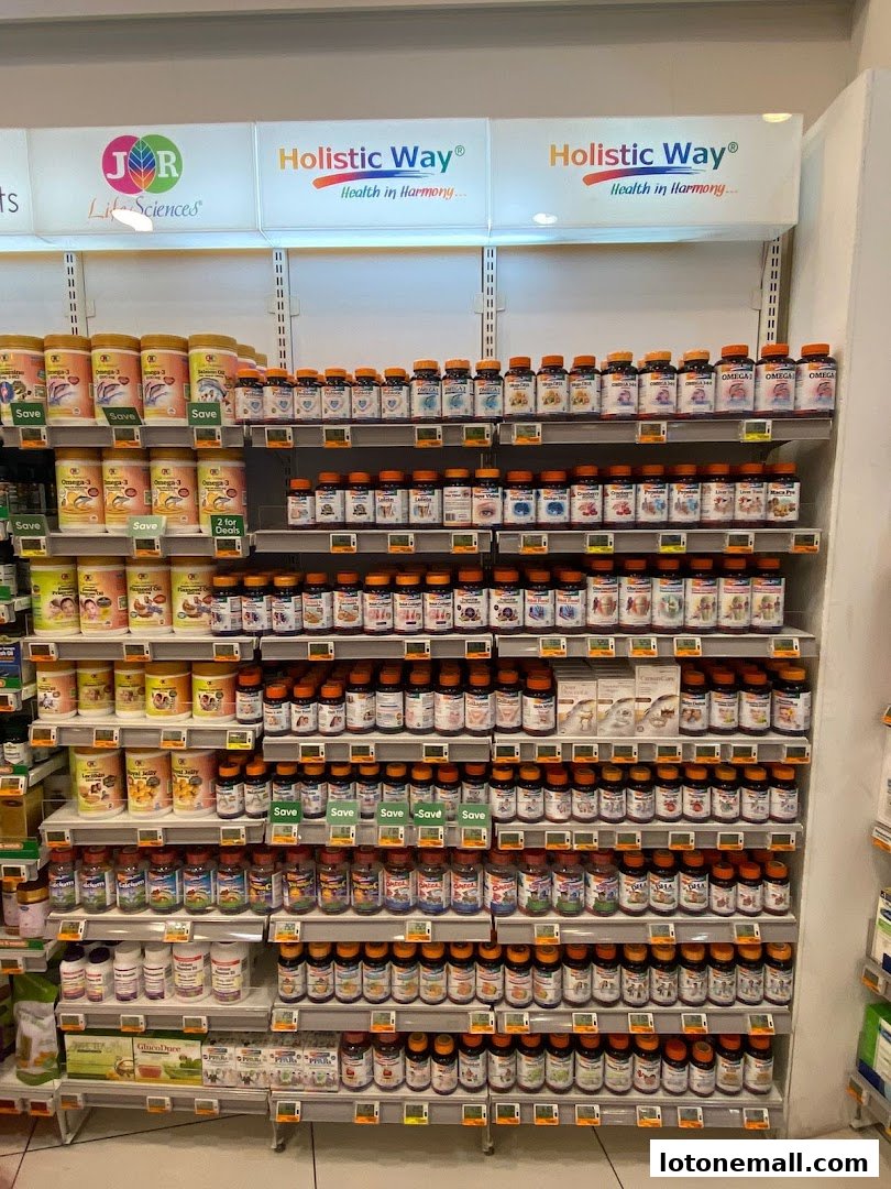 Shelves stocked with various health supplements and vitamins, featuring brands like Holistic Way.