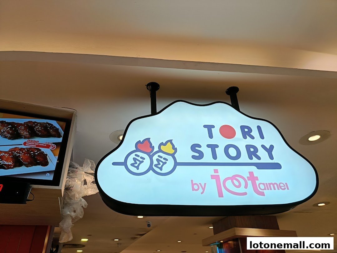 A sign for Tori Story by i@taimei, featuring fried chicken and bubble tea.