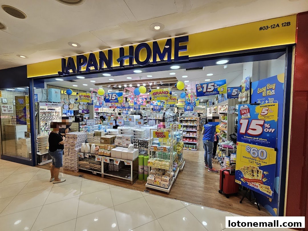 The entrance of a Japan Home store, showcasing various products and promotional signs.