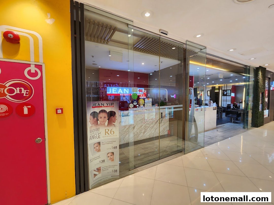 The exterior of Jean Yip Hairdressing and Beauty salon with promotional posters.