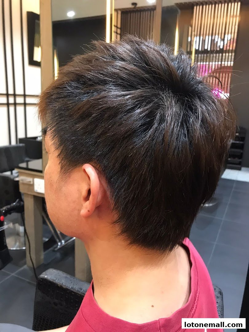 A close-up of a person's styled hair, showcasing a fresh haircut.