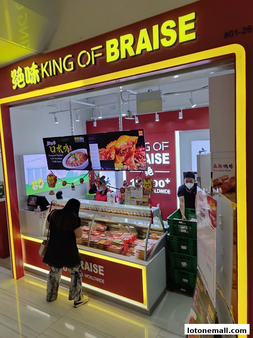 A JUEWEI King of Braise shop with a display of braised food and customers.