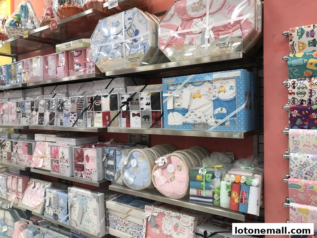 Shelves filled with various baby gift sets and clothing items, neatly packaged.