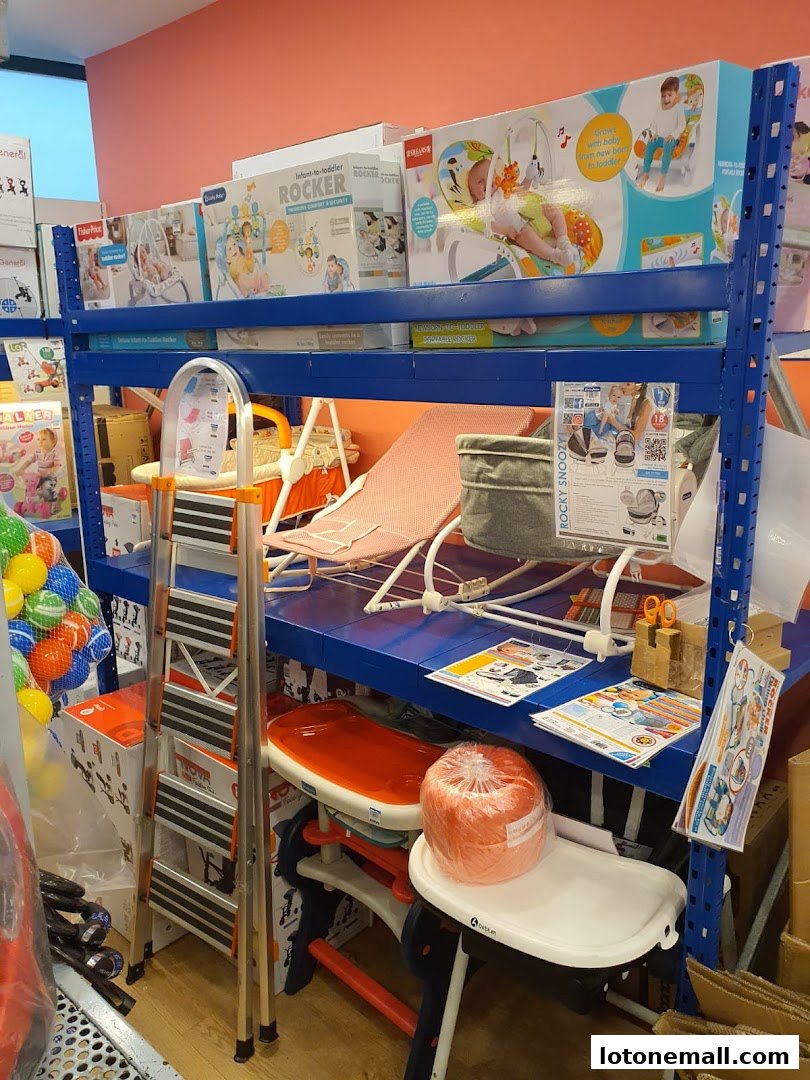 Shelves stocked with baby rockers, high chairs, and other infant products.