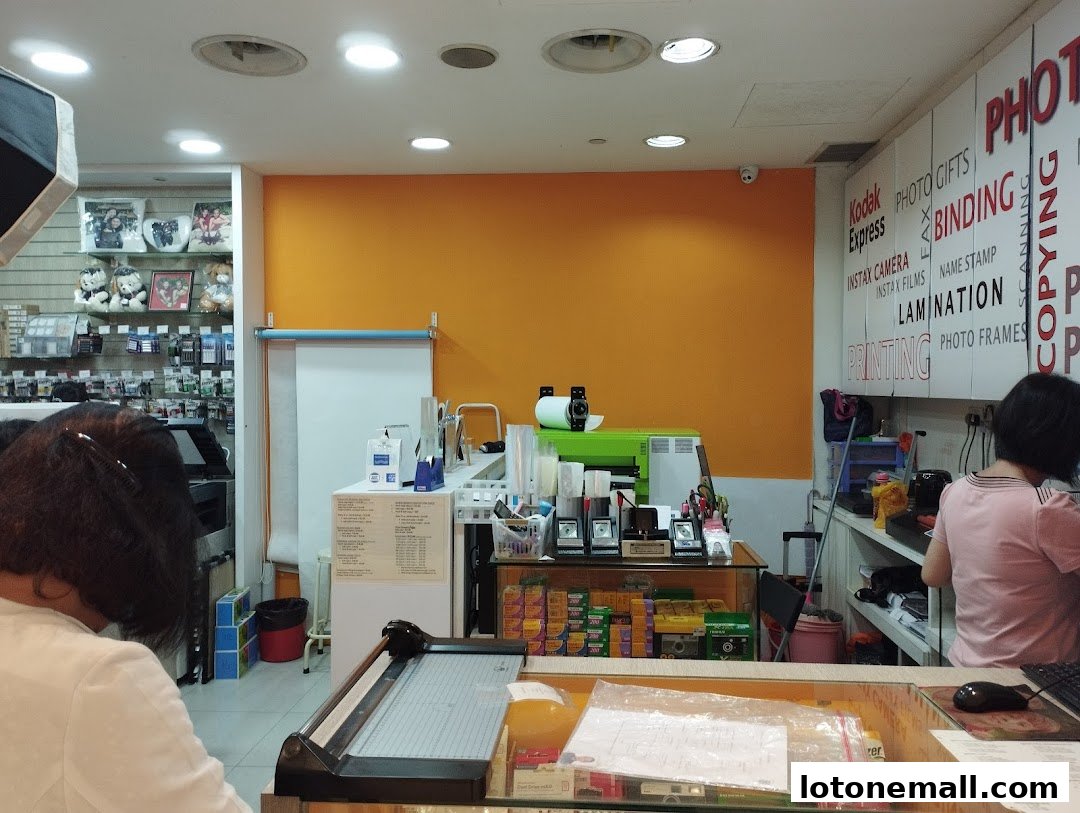 Interior of a Kodak Express shop with printing and photo services.