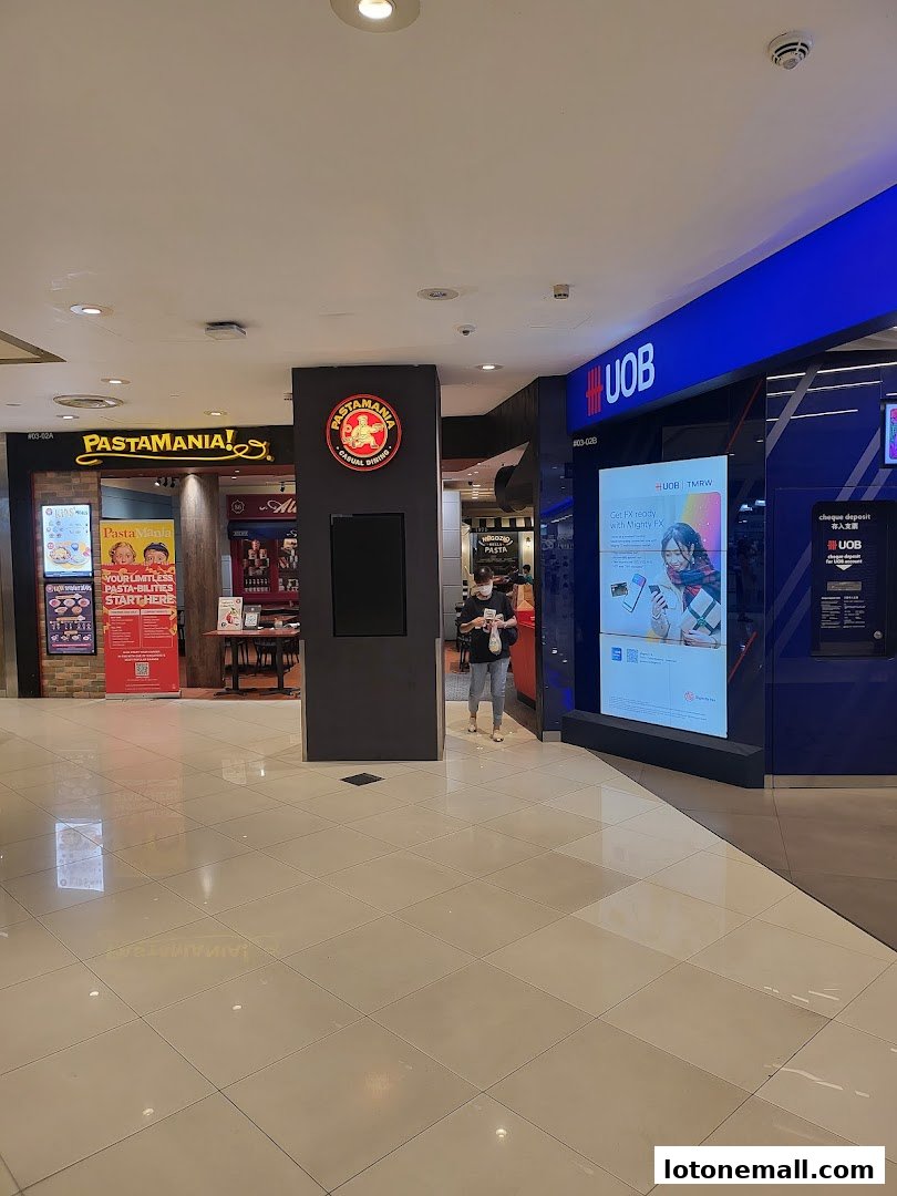 A view of the entrance to Pastamania and a UOB bank branch in a mall.