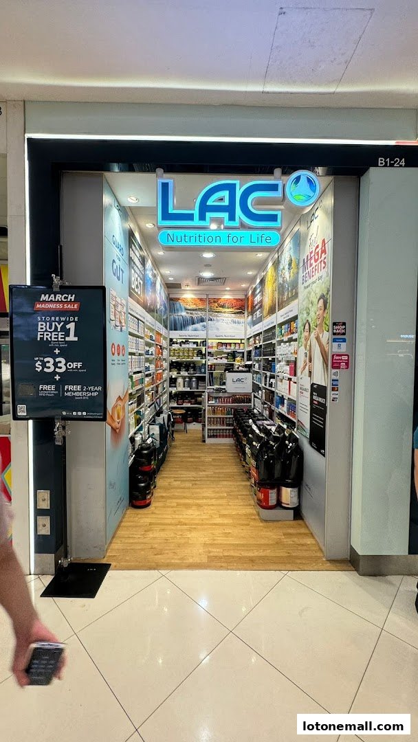 The entrance of LAC Nutrition For Life store, showcasing health supplements and a March Madness Sale.