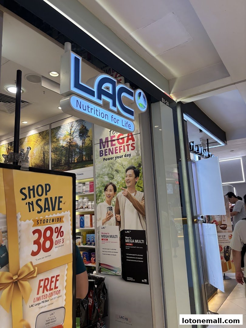 The storefront of LAC Nutrition for Life, featuring a prominent sign and promotional displays.