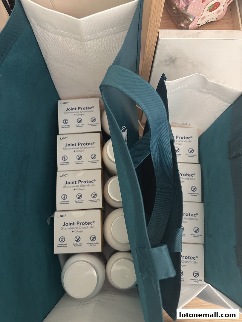 A shopping bag filled with LAC Joint Protec supplements and other items.