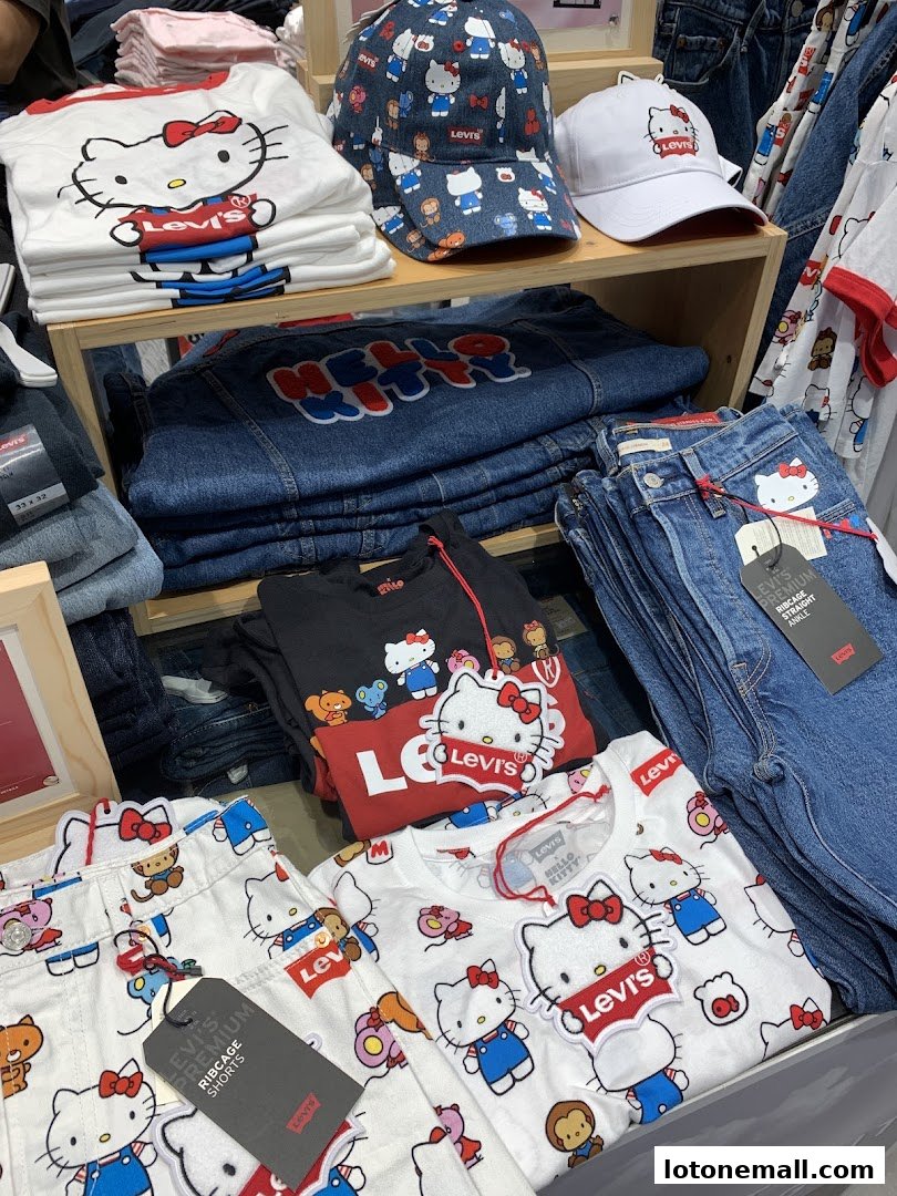 A display of Levi's apparel featuring Hello Kitty designs, including t-shirts, shorts, and caps.