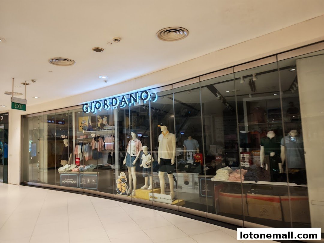 The Giordano store front displays mannequins wearing casual clothing and merchandise inside.