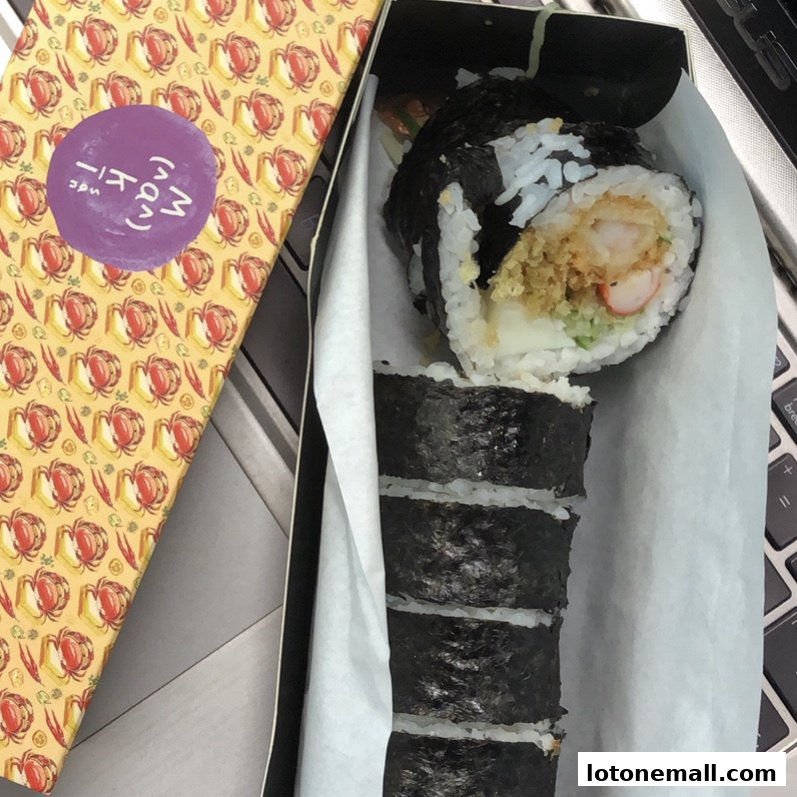 A box of Maki-San sushi rolls with a distinctive patterned lid.