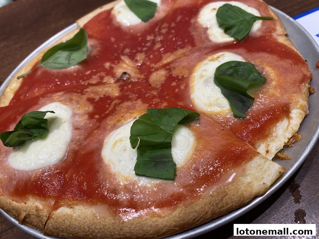 A close-up shot of a delicious Margherita pizza with fresh basil leaves.