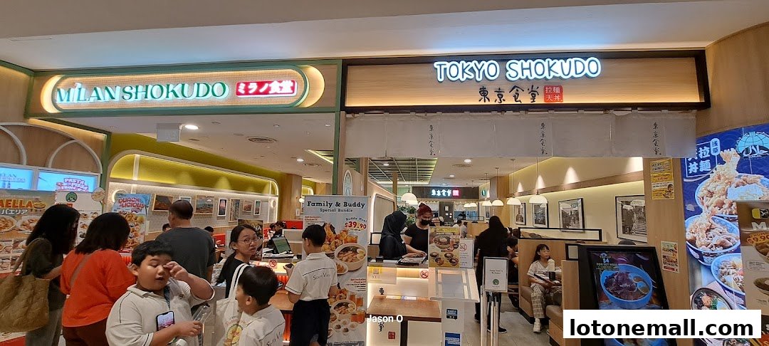 A bustling view of two Japanese restaurants, Milan Shokudo and Tokyo Shokudo, with customers and food displays.