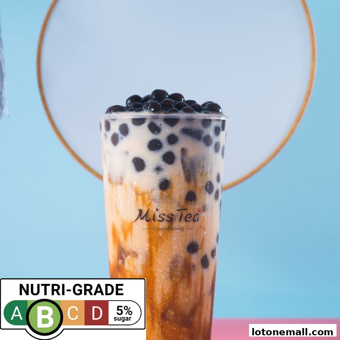 A close-up of a bubble tea drink with the Miss Tea logo and a Nutri-Grade label.