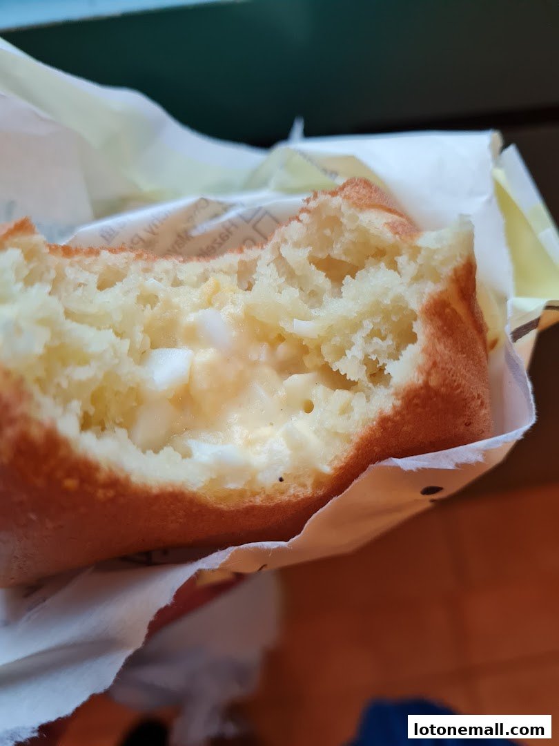 A close-up shot of a delicious-looking pastry with a creamy filling.