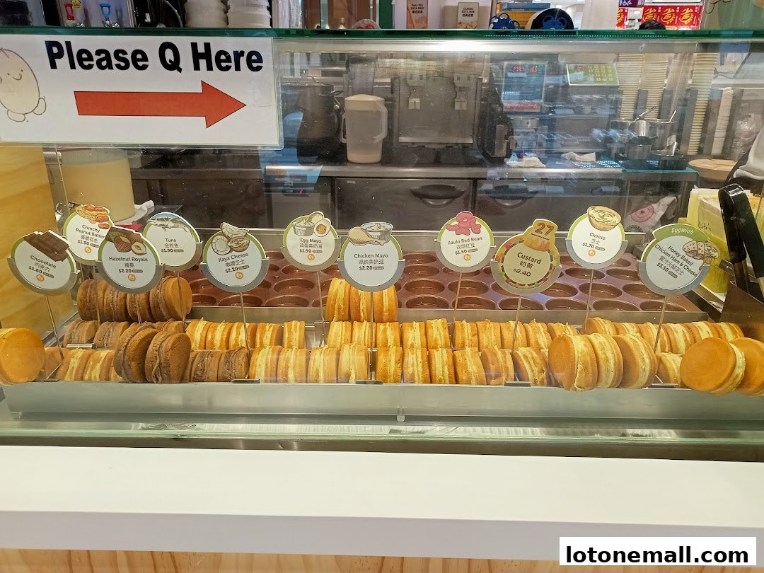A display case filled with freshly made sweet and savory filled pancakes.