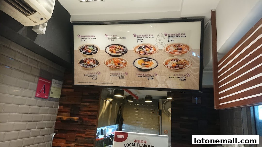 A menu board displaying various grass jelly and ai-yu jelly desserts with prices.