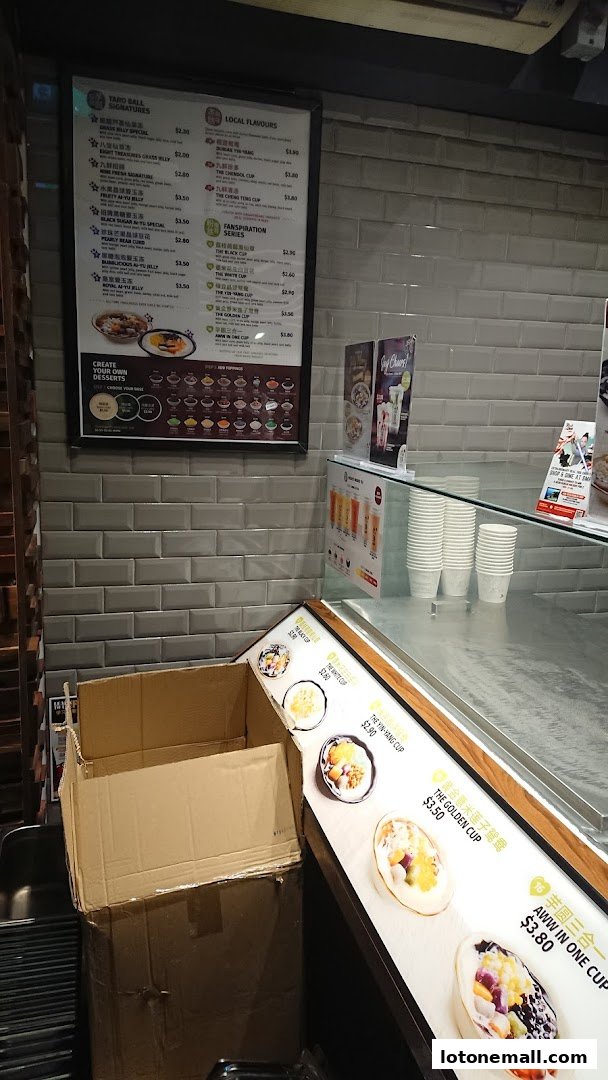 A menu board displaying various Taiwanese desserts and drinks with prices.